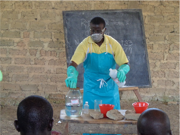Demonstrating the Use of Formic Acid Robert W Thomas Jr , Supervisor at Firestone Liberia’s quality control department demonstrating the use of formic acid at a workshop in Gaitanyeah.