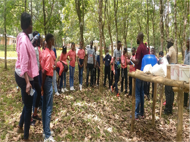 Students of the Heritage International Academy viewing a tapping demo at Firestone Liberia