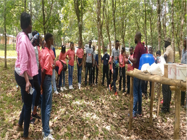 Students of the Heritage International Academy Students of the Heritage International Academy viewing a tapping demo at Firestone Liberia