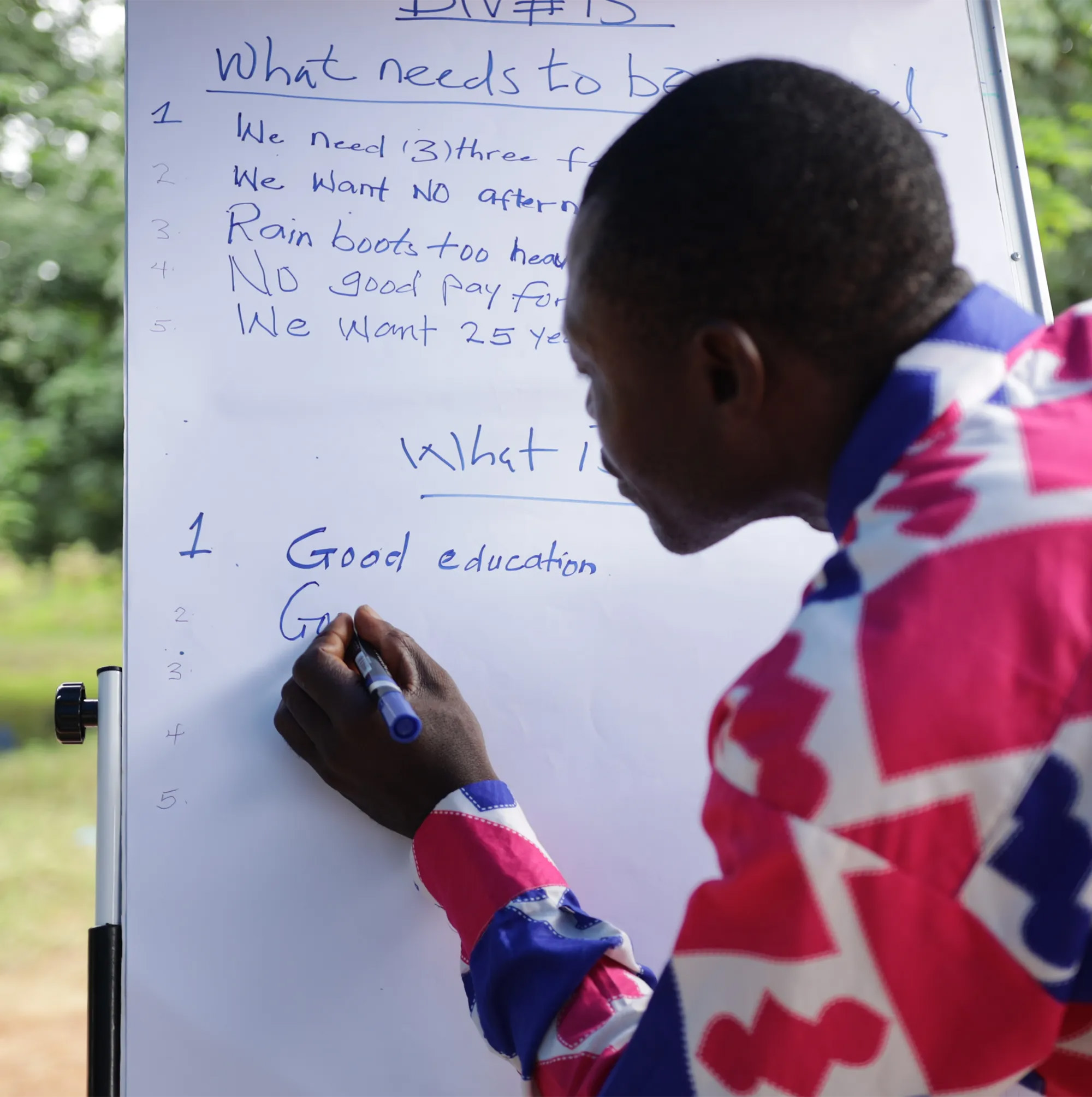 Person writing on blackboard