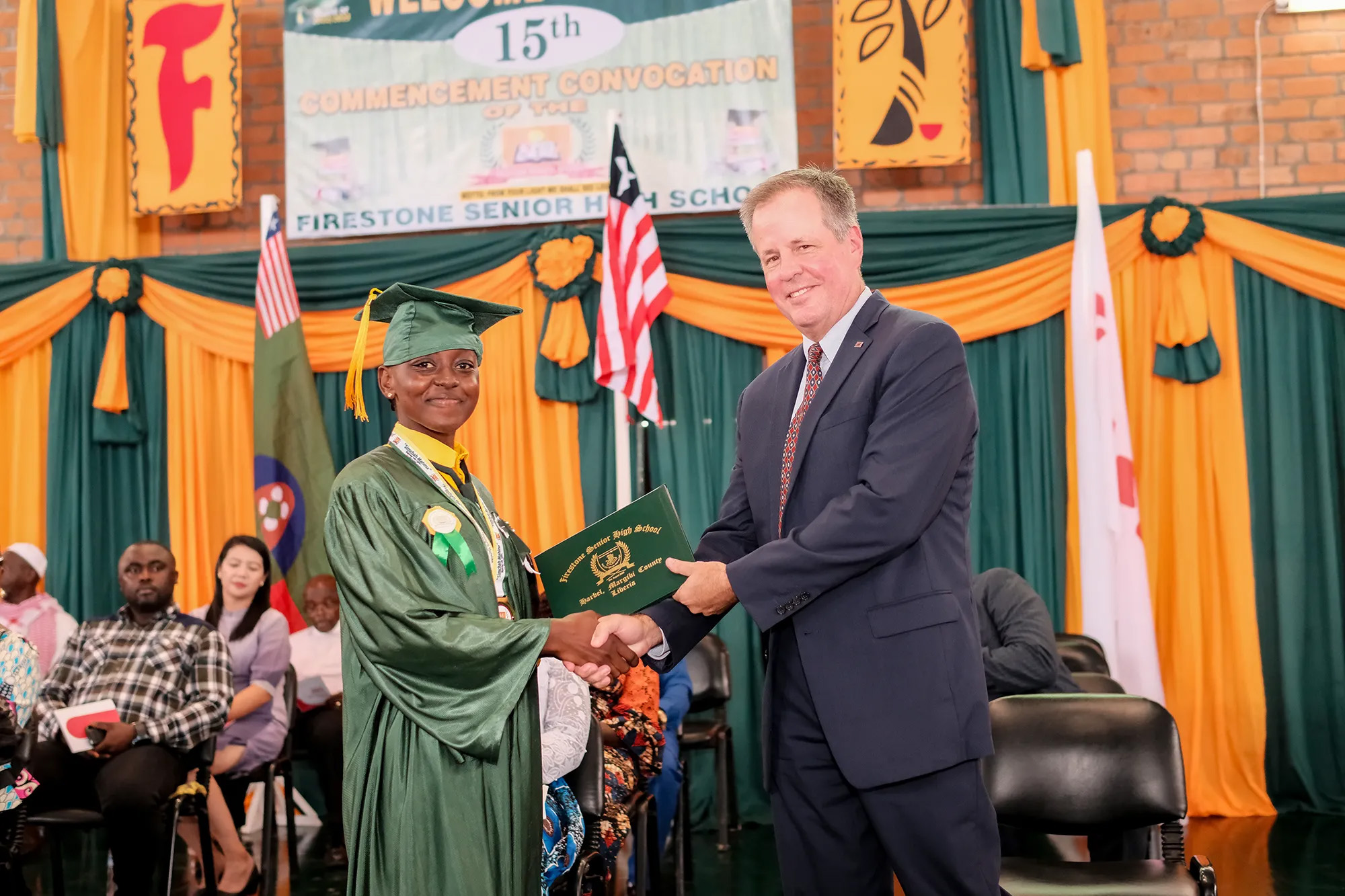 student receiving his degree at graduation
