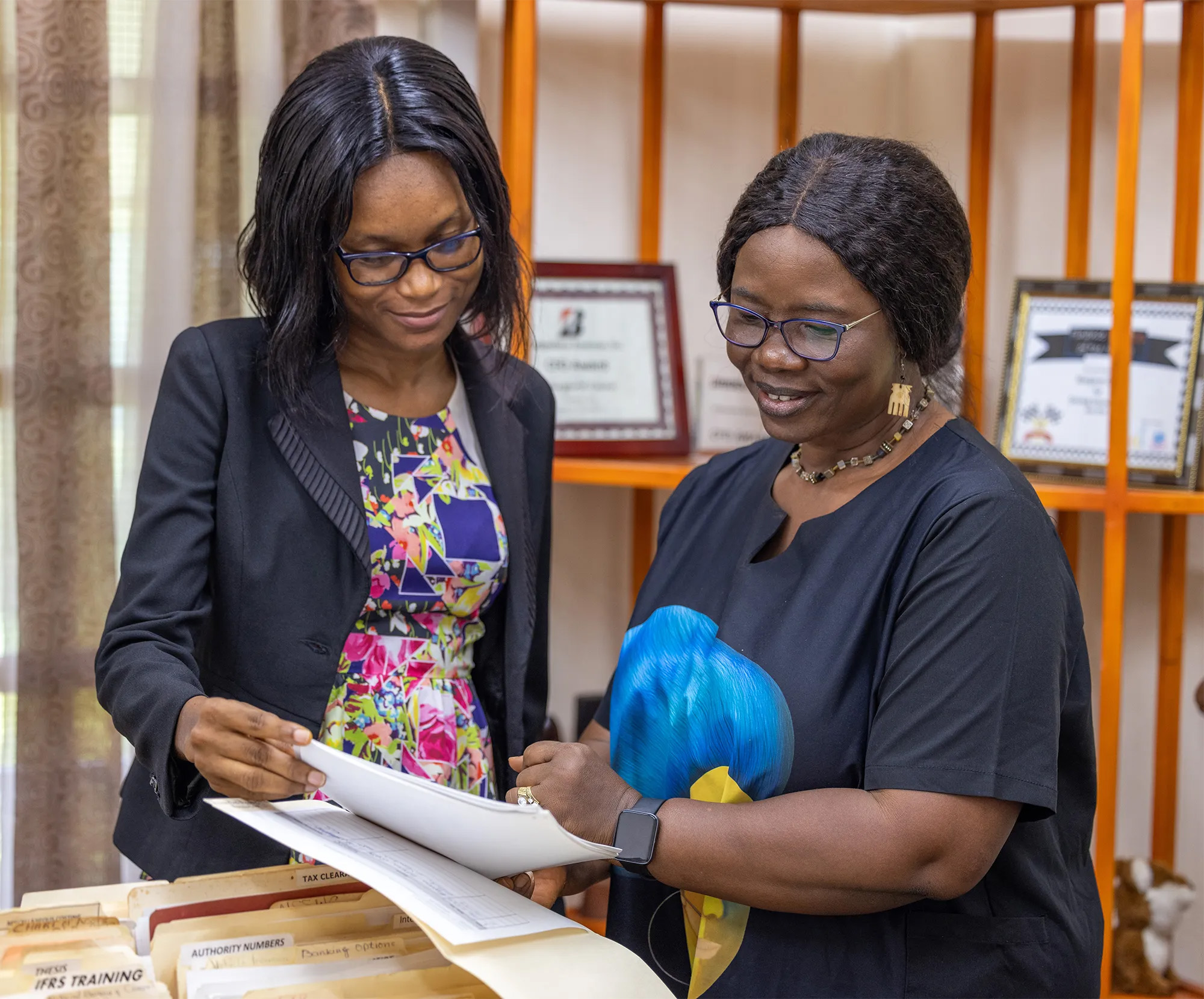 women reviewing files